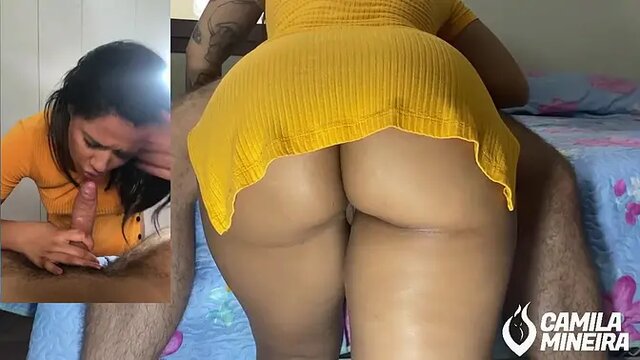 naughty brunette cowgirl giving a close up blowjob