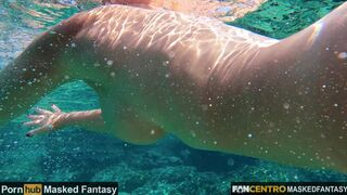 Hot MILF undressing under water and swims naked in the sea with pussy closeup