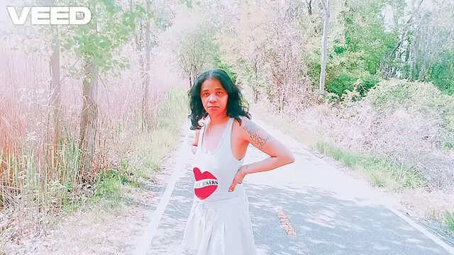 Solo female in skirt teases on the beach